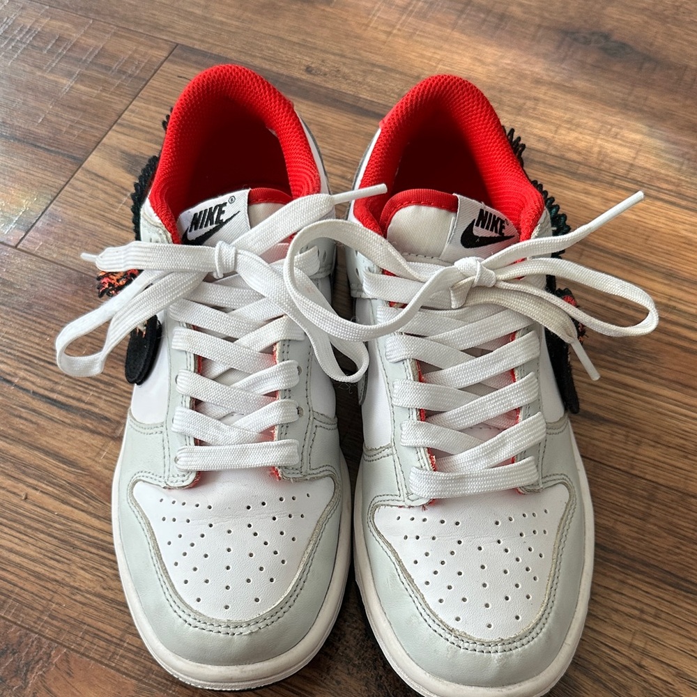 Nike Women's White and Black Sneakers with Red Accents